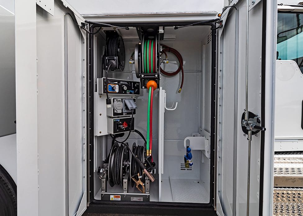 torch bottle and welding reel for torch bottle compartment.