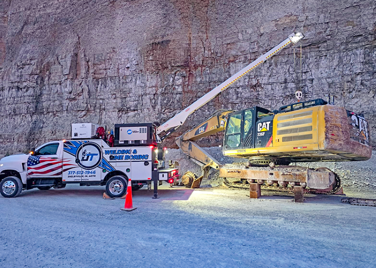 JT Welding & Line Boring’s Summit service truck, equipped with a crane and tool storage.